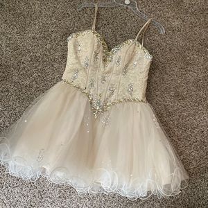 Prom Dress Size 4. Beaded crisscrossed tie up in back of dress. Worn once.